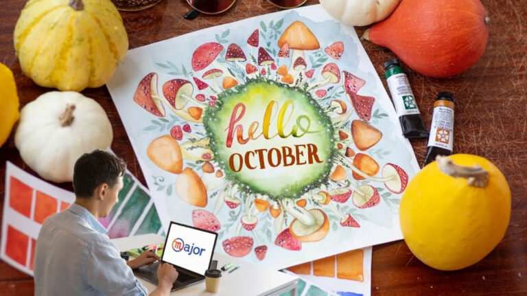 Un homme devant un ordinateur avec une serviette indiquant "hello october"